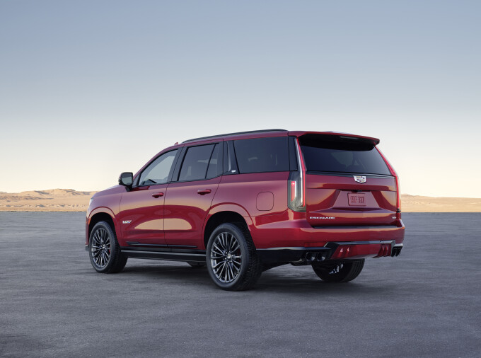 The rear fascia incorporates openings for quad exhaust outlets.