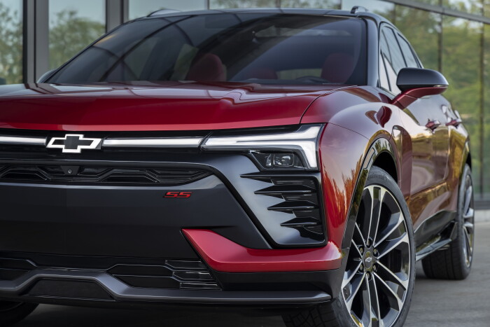 Close up of front grille, illuminated headlights and wheel on 2024 Chevrolet Blazer EV SS in Radiant
