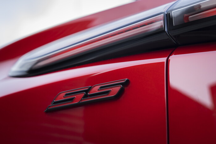 Close up of SS badge under passengers side taillight on 2024 Blazer EV SS in Radiant Red Tintcoat. P