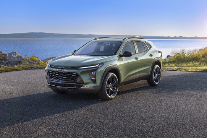 3/4 view of Chevrolet Trax ACTIV in Cacti Green parked on a road in front of a lake. Pre-production 