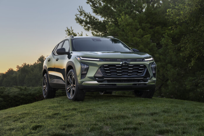 Front 7/8 view of Chevrolet Trax ACTIV in Cacti Green parked on a grassy hill. Pre-production model 