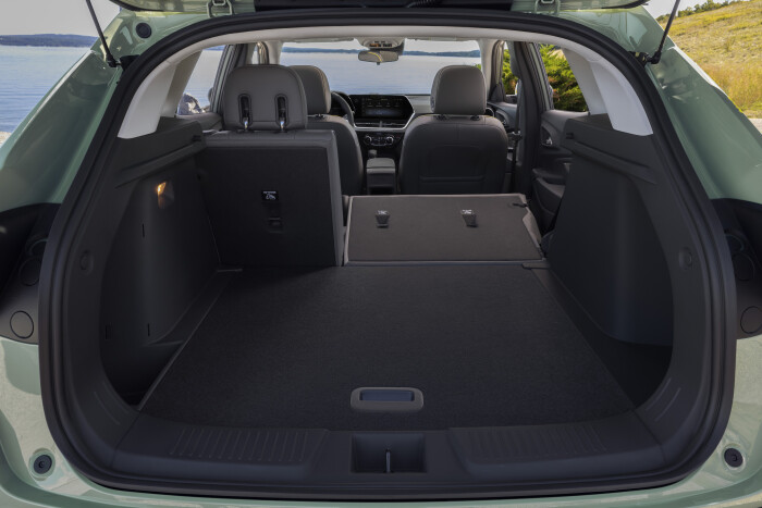View from cargo space to front cabin with the right side and middle seat collapsed in Chevrolet Trax