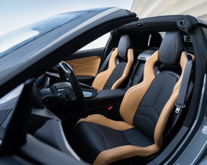 Driver side 3/4 view of 2024 Chevrolet Corvette E-Ray 3LZ convertible with Natural Tan Interior. Pre-production model shown. Actual production model may vary. Model year 2024 Corvette E-Ray available 2023.