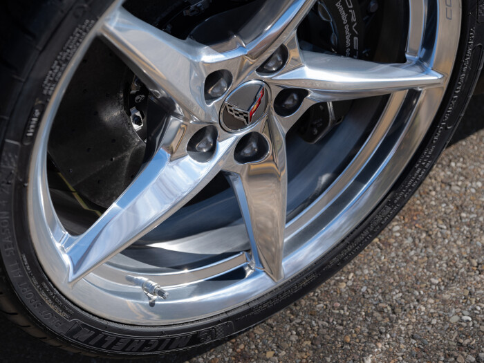 Close up view of aluminum wheel with Pearl Nickel finish on 2024 Chevrolet Corvette E-Ray 3LZ. Pre-production model shown. Actual production model may vary. Model year 2024 Corvette E-Ray available 2023.