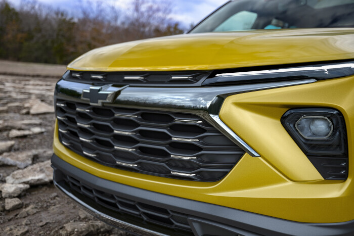 Close up view of grille and driver side headlight on 2024 Chevrolet Trailblazer ACTIV in Nitro Yellow Metallic. Preproduction model shown. Actual production model may vary. Available in fall 2023.
