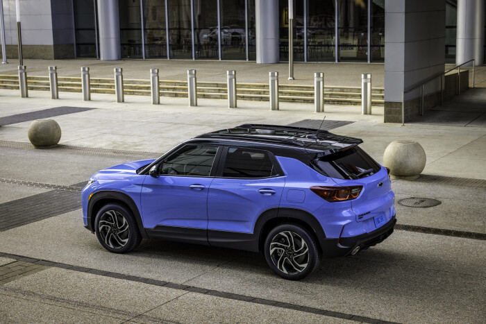 Rear 7/8 view of 2024 Chevrolet Trailblazer RS in Fountain Blue parked in front of a building. Preproduction model shown. Actual production model may vary. Available in fall 2023.