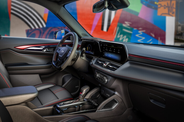 View of front cabin from passengers side of the 2024 Chevrolet Trailblazer RS with Jet Black with Red Accents interior. Preproduction model shown. Actual production model may vary. Available in fall 2023.