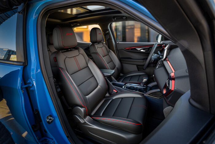 View of front cabin from passengers side in 2024 Chevrolet Trailblazer RS in Fountain Blue with Jet Black with Red Accents interior. Preproduction model shown. Actual production model may vary. Available in fall 2023.