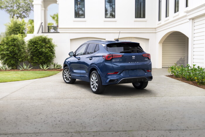 Rear 3/4 view of the 2024 Buick Encore GX Avenir in Ocean Blue Metallic. Preproduction model shown. Actual production model may vary. Available in Spring 2023.