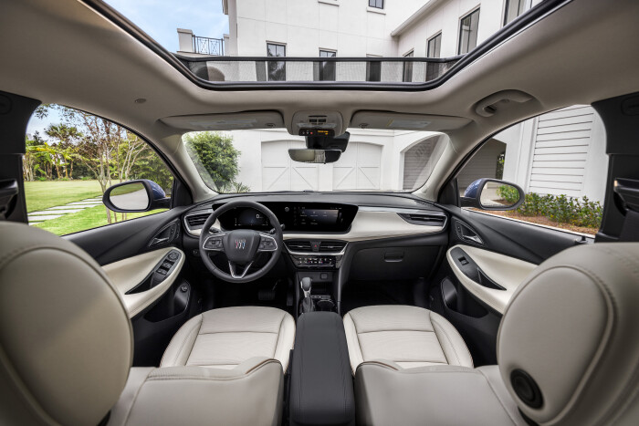 View of front cabin in 2024 Buick Encore GX Avenir with Whisper Beige and Jet Black interior. Preproduction model shown. Actual production model may vary. Available in Spring 2023.