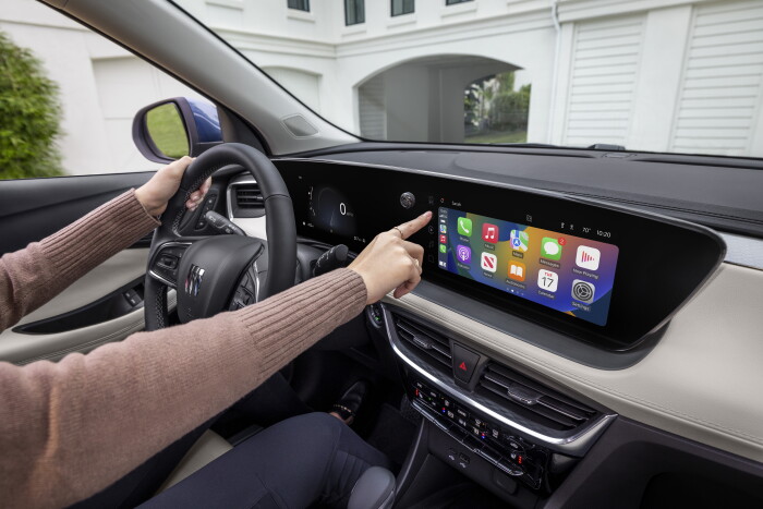 Driver interacting with the new Virtual Cockpit System in the 2024 Buick Encore GX Avenir. Preproduction model shown. Actual production model may vary. Available in Spring 2023.