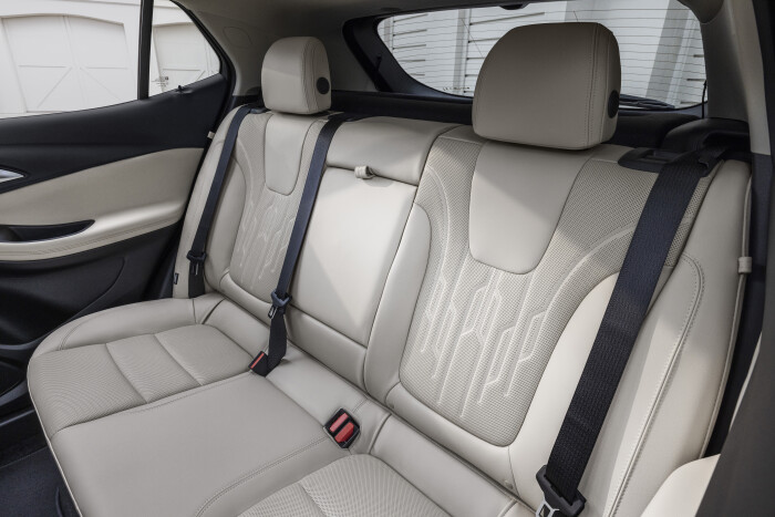 View of the rear seats in 2024 Buick Encore GX Avenir with Whisper Beige and Jet Black interior. Preproduction model shown. Actual production model may vary. Available in Spring 2023.