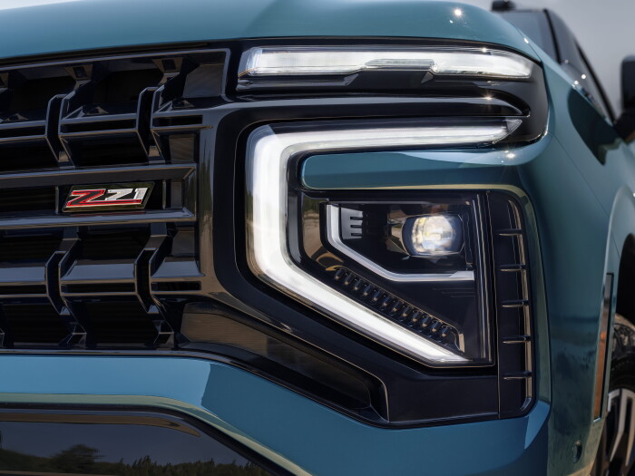 Detailed shot of new headlight and  Z71 badge in grille of the 2025 Tahoe